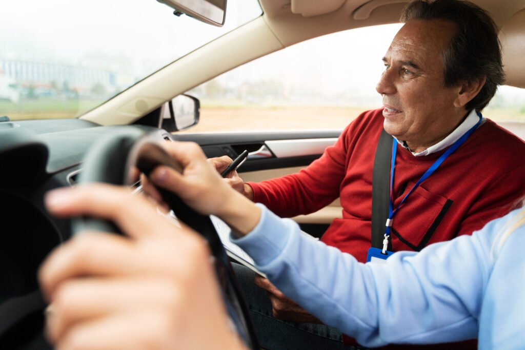 Driving instructor guiding a beginner student in a car