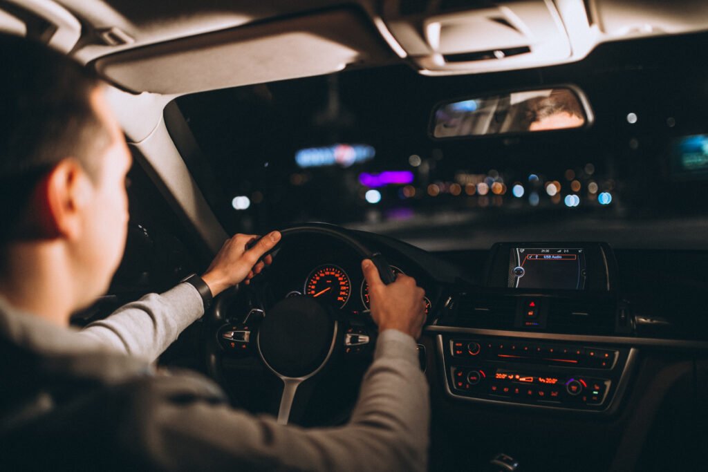 Learner driver adjusting car controls before driving test